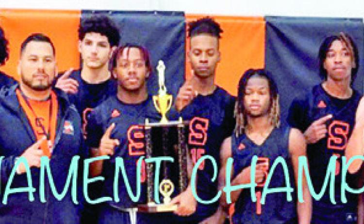 THE SOMERVILLE YEGUAS hold their championship trophy from the Koppers Tournament.