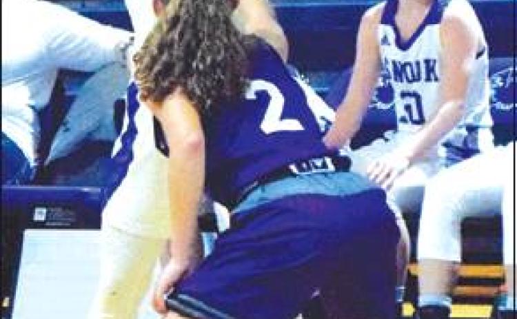 NATALIE VACHA LOOKS to pass the ball during the Lady Jays’ win over Number 23 Douglass Friday night in Snook.