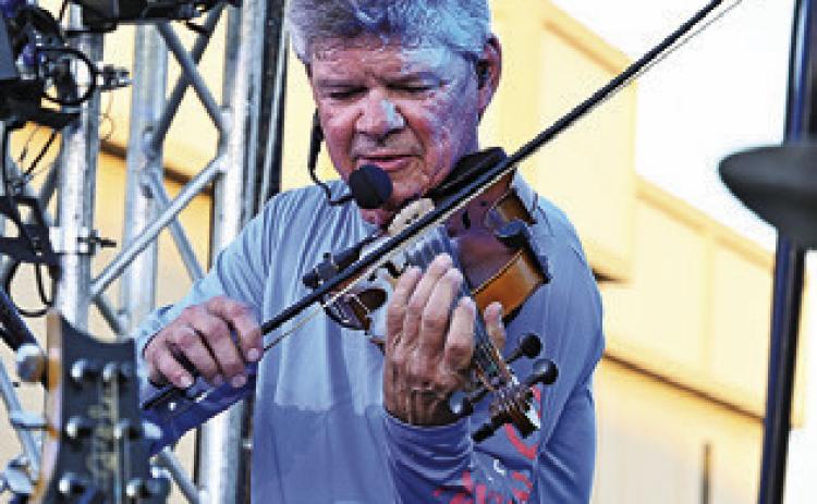 EVERYONE LOVED the fiddle during Texas Unlimited Band’s performance at Main Street Caldwell’s “Summer Concert Series.” Tribune photo by Denise Squier