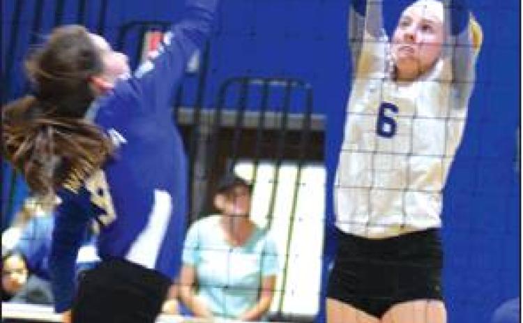 SNOOK’S JAYCIE BRISCO leaps to block a hit from a Navasota player during the annual Snook Volleyball Tournament last week.