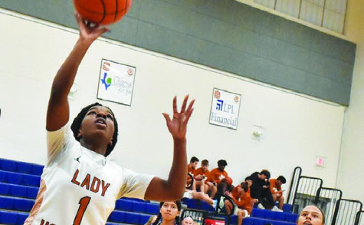 CALDWELL AMOREE DENSON attempts a layup during the Lady Hornets’ victory over Austin Achieve last Friday night at Hornet Gym.