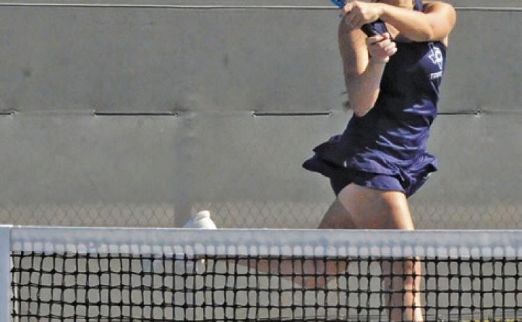 CALDWELL’S KYLIE VOGLER returns the ball during the Hornets’ team tennis regional semifinal match against Franklin last Thursday. Tribune photo by Denise Squier