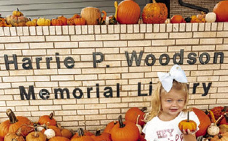 KAISLEY KUBENA holds this pumpkin in the pumpkin patch benefiting Project SNIP at the Harrie P. Woodson Memorial Library. For the Oct. 29 edition of The Tribune, email photos of your kiddos, or fur babies, with pumpkins for our special “Ghoul Zone” at news@bctribune.com by midnight on Monday, Oct. 26. Include your child’s name and any information about the photo.