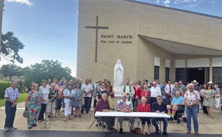 OFFICERS AND MEMBERS OF KJT Society #100, along with members of St. Mary’s Our Lady of Lourdes Catholic Church, celebrated Flag Day with the signing of a proclamation signed by Mayor John Rychlik. The KJT, Czech Catholic Union of Texas, encourages it’s members to recognize Flag Day each year in various ways. Society #100 appreciates the City of Caldwell and Mayor Rychlik for their cooperation with this project. Photo courtesy of Donna Rychlik
