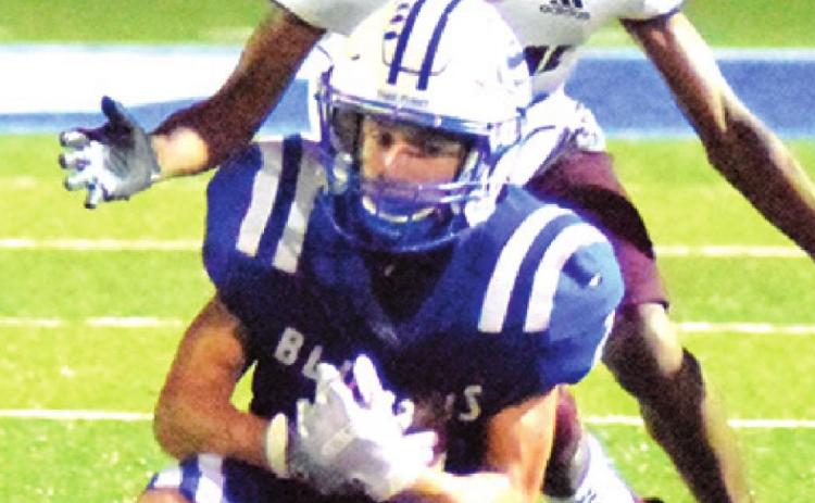 LANCE LARA makes a catch during the Snook-Hearne game last Friday in Snook.
