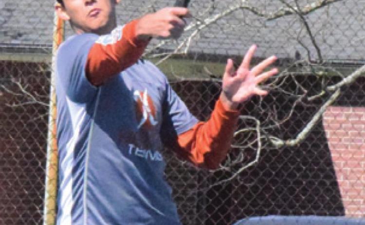 ISAAC SALAZAR backhands the ball at the Rockdale Tiger Classic Tennis Tournament on Friday. -- Tribune photo by Denise Hornaday