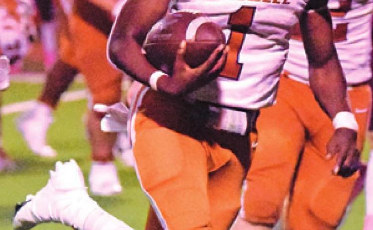 JAMAR HEWITT carries the ball for Caldwell. Hewitt gained 236 rushing yards.