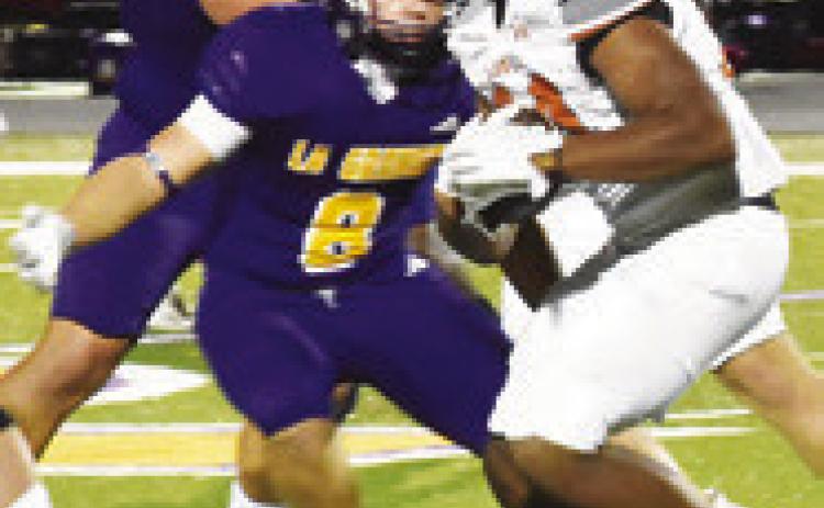 MICHAEL BUTLER carries the ball for Caldwell against La Grange.