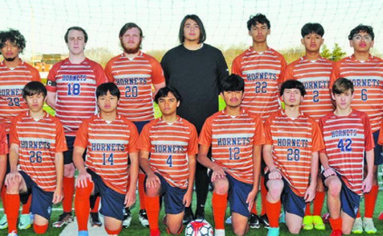 THE 2023 CALDWELL HIGH SCHOOL HORNET VARSITY SOCCER TEAM is, from left, front, David Lopez, Alex Reyes, Nam Le, Benjamin Jaimes, Quetzacoatl Bautista, Francisco Martinez, Mark LaSeur, David Goff, back, Coach Burt Yates, Steven Amaya, Barret Yates, James Coston, Nicholas Rutherford, Jeffrey Tobias, Daniel Morales, Jose Alvarez and Coach Wayland Jenkins. -- Photo courtesy of Dianne Pursch Photography