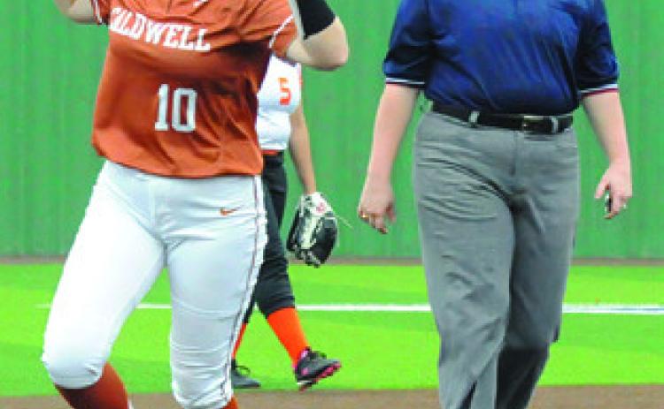 KELLY URBANOVSKY celebrates hitting a home run over the center field wall in the first inning. -- Tribune photo by Denise Squier
