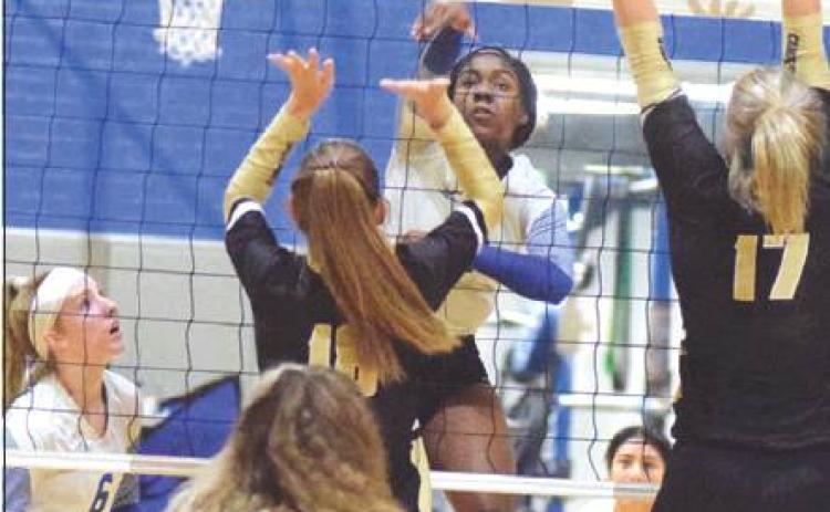 SNOOK’S JAIVAN STRINGFELLOW kills the ball during Snook’s loss to Round Top-Carmine on Tuesday in Snook. Stringfellow had 11 kills during the four-set loss. -- Tribune photo by Denise Hornaday