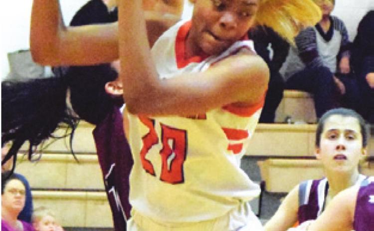 XADRIA MARTIN had her second doubledouble in the past two weeks during Somerville’s 47-25 home win over Iola Friday night. She is pictured pulling down one of her 15 rebounds. -- Tribune photo by Denise Hornaday