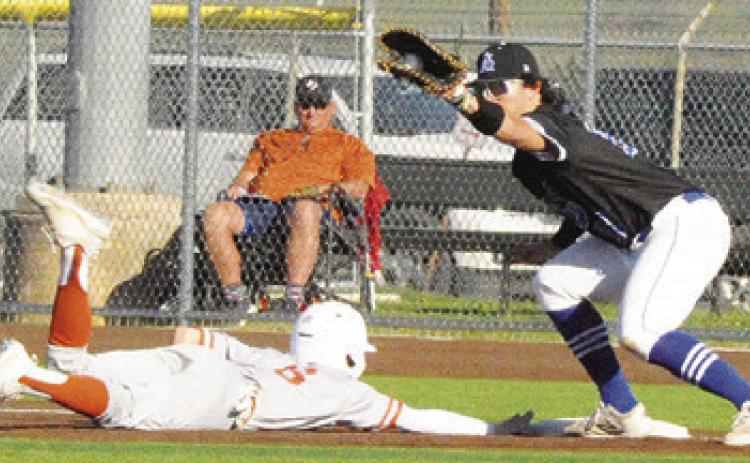 CALDWELL’S ZANE BROWN slides to base against Anderson Shiro at the tournament. Caldwell won 8-3. -- Tribune photo by Denise Squier