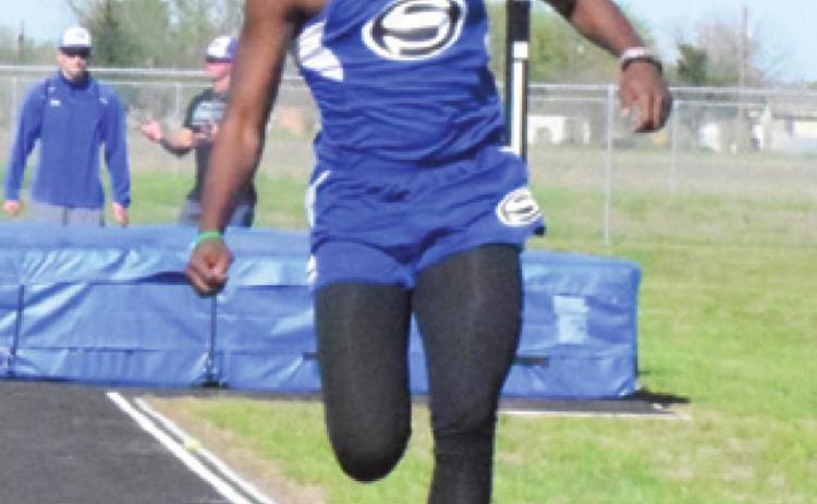 DALVON WORKMAN competes in the triple jump during the Snook Track Meet last Thursday. -- Tribune photo by Denise Squier