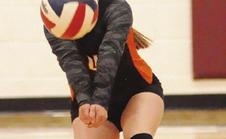 RHYAN RICCI bumps the ball during the Somerville-Hearne match last Friday. Tribune photo by Denise Squier