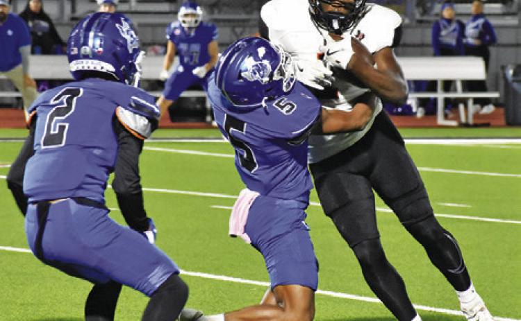 Tribune photo by Roy Sanders KEITH CRAWFORD OF Somerville carries the ball against Ben Bolt.