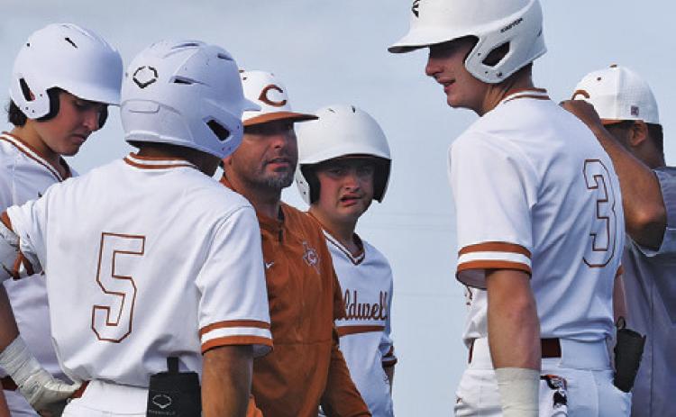 CALDWELL HEAD COACH Kyle Toney talks to his team between innings of a recent game. -- Tribune photo by Roy Sanders