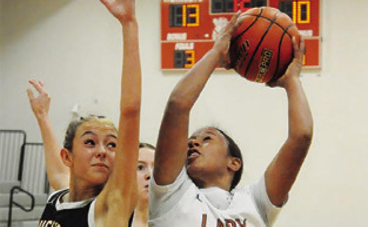 AVA JONES TRIES to get off a shot during the Caldwell-Bruceville-Eddy game last Monday. -- Tribune photo by Denise Squier