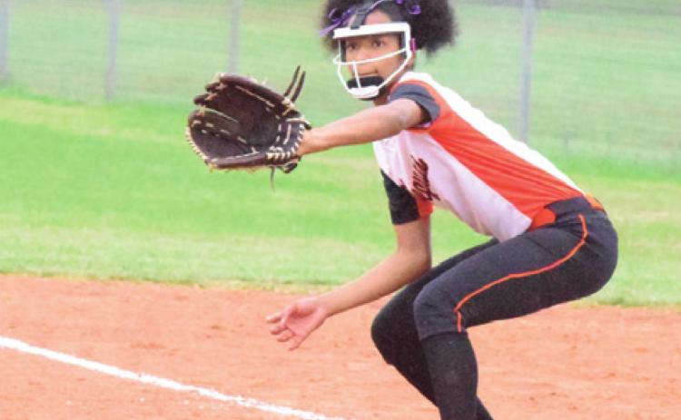 SOMERVILLE’S RA’MAYA CARTER prepares to catch a throw for a forced out at first base during the Lady Yeguas’ win over Iola Monday afternoon during Spring Break. -- Tribune photo by Denise Hornaday