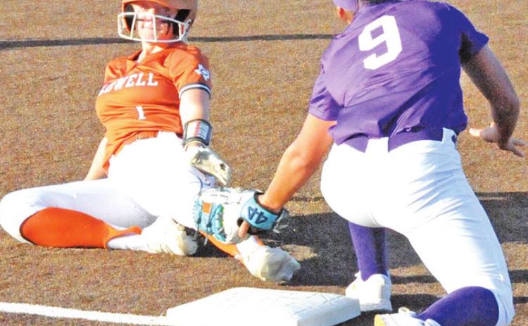 CALDWELL’S CAITLYN FAUST slides under the tag of the Florence third baseman during the Lady Hornets ‘s 15-8 win over the Lady Buffs at Lady Hornet Field. -- Tribune photo by Denise Squier