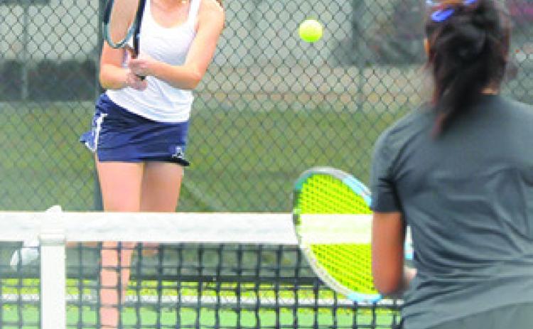 KYLIE VOGLER returns the ball during a mixed doubles match at the District 22-4A Tournament last week in Caldwell. She and Cayden Zboril won the mixed doubles title and qualified for the regional tournament.