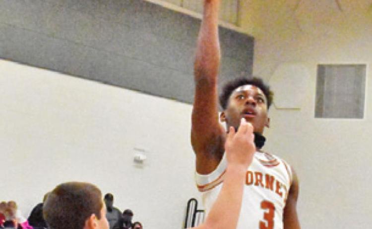 CALDWELL’S DONTAVIEN Johnson takes a shot in the Hornets victory over Rockdale. -- Tribune photo by Roy Sanders