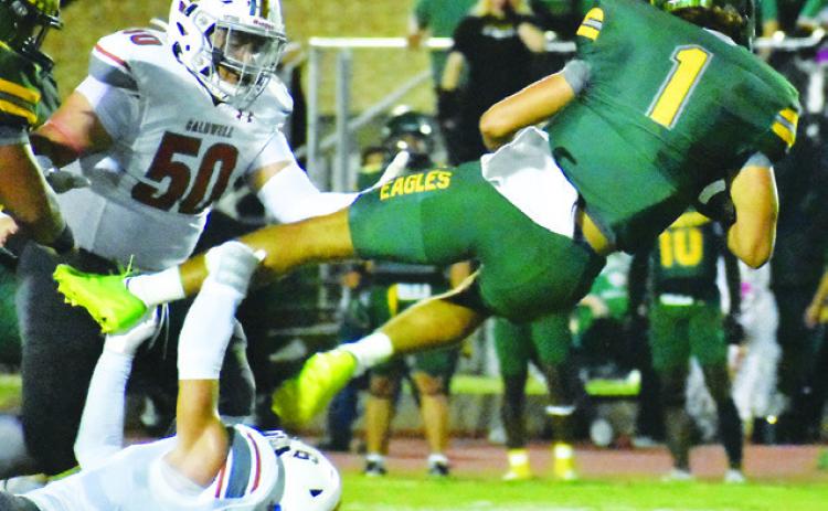 JAXON ANDERSON OF CALDWELL makes this tackle last Friday against Lexington in the Hornets’ final non-district game. Also pictured is Caldwell’s Davian Sanchez. Tribune photo by Roy Sanders