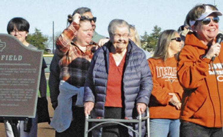 LONGTIME LADY HORNET softball coach Wendy Weiss thanks the community for honoring her by renaming the softball field “Weiss Field.” Her family also attended the ceremony. Tribune photo by Denise Squier