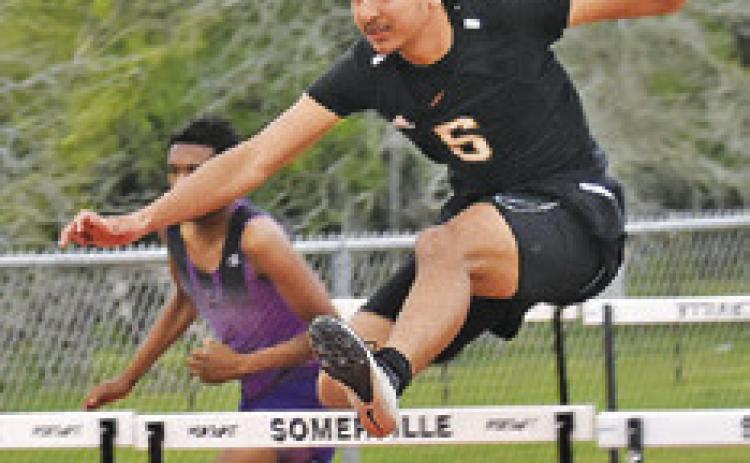GARDNER SHIVERS jumps over this hurdle during the Koppers Relays last week.