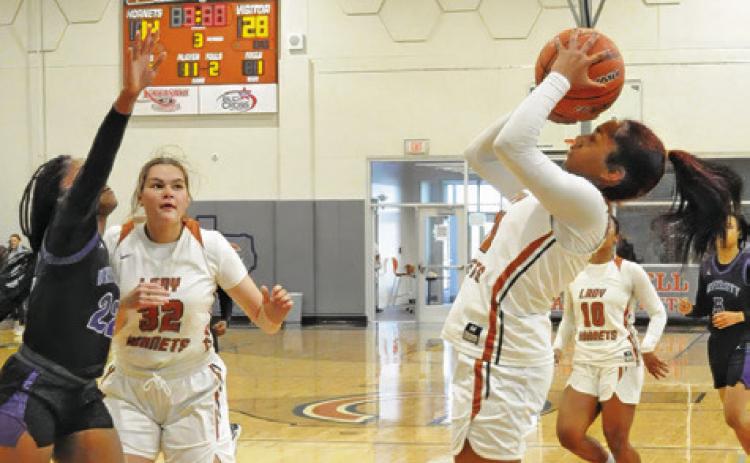 CALDWELL’S AVELYNN O’RILEY shoots over a Waco University defender during their game last Monday at Hornet Gym. Tribune photo by Denise Squier