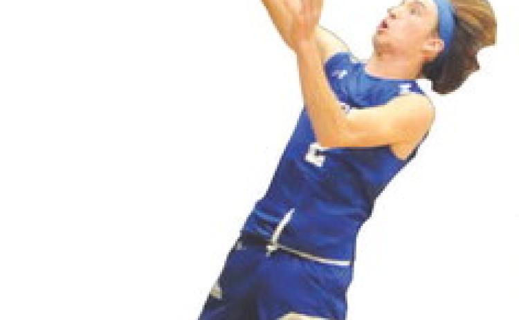 SNOOK’S BRETT Withem takes a shot against Mumford last Friday. Snook lost 58-40. Tribune photo by Denise Squier