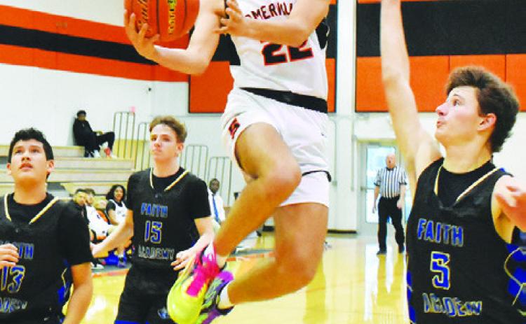 GAVIN WILLIAMS OF Somerville leaps high for this shot against Bellville Faith Academy. -- Tribune photo by Roy Sanders