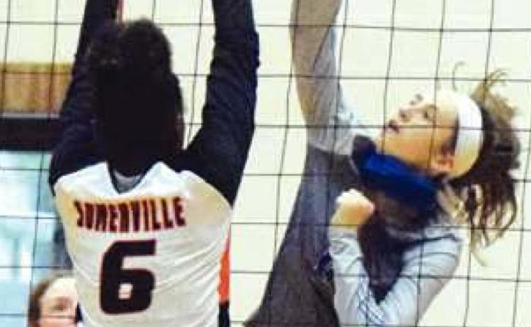 SNOOK’S RILEY Green and Somerville’s Camia Martin battle at the net during Round 2 of the Burleson County Showdown last Friday.