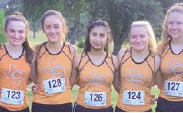 THE CALDWELL VARSITY GIRLS cross country team won the team title at the Bellville Booster Club Invitational on Saturday. Pictured, from left, are Melodie Parker, Kate Urbanovsky, Morgan Becka, Jackie Gutierrez, Zoe Zwernemann, Tess Homeyer and Daisha Denson.