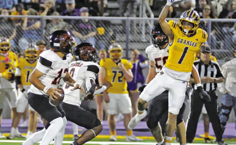 SOMERVILLE’S ANDY ESPINOZA gets ready to pass against Granger as Ja’Keith Daniels prepares to block. Tribune photo by Denise Squier