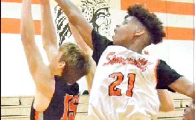 DOMINIC TUCKER of Somerville fights for this rebound against Centerville at the Somerville Tourney. -- Tribune photo by Roy Sanders