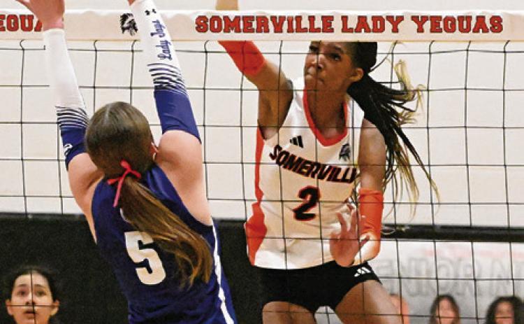 SOMERVILLE’S KARYS ELLIS earns one of her 11 kills against Snook last Tuesday by hitting the ball past Snook’s Kiley Price. Tribune photo by Denise Squier