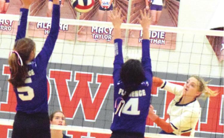 CALDWELL’S KADIE HARTMAN hits the ball between two Florence blockers during the Lady Hornets’ win over the Lady Buffs last Tuesday night at Hornet Gym. -- Tribune photo by Denise Hornaday AAAAA KADIE HARTMAN blocks a hit from Florence’s Abbey Brown during Caldwell’s win last Tuesday. -- Tribune photo by Denise Hornaday AAAAA MACY TAYLOR BLOCKS a hit by a Florence player during the Caldwell-Florence match last Tuesday night in Caldwell.