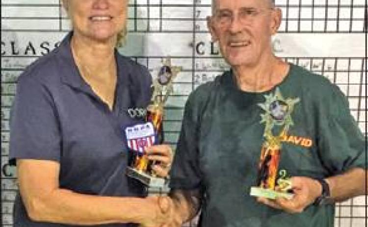 DORIS HIEDEN WON the Class A 30 title at the Kilgore Heat Beater Horseshoe Tournament on Friday. She is pictured with David Orban of Kilgore who places second.