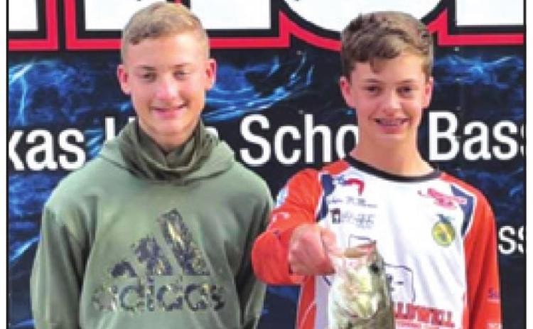 COOPER ODENBACH and Grant McManus show off their catch of the day at the Texas High School Bass Association’s tournament at Lake Conroe on Saturday, March 13.