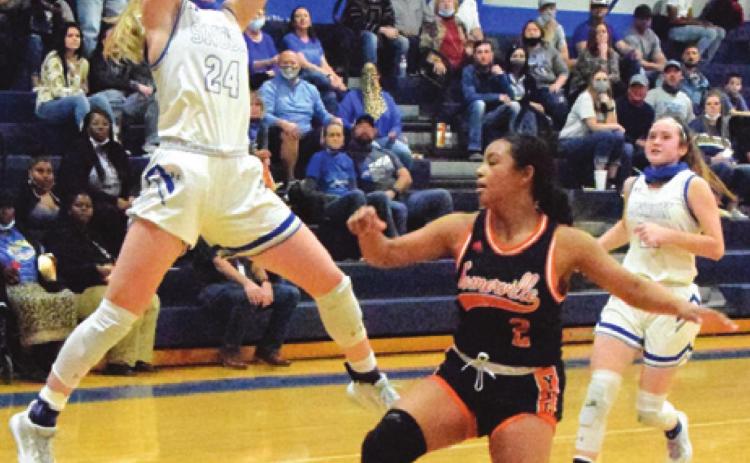 SNOOK’S JAYCIE BRISCO GRABS a pass from a teammate during a fast break while Somerville’s Jazmine Jackson defends during the Lady Jays’ win last Friday night. -- Tribune photo by Denise Squier