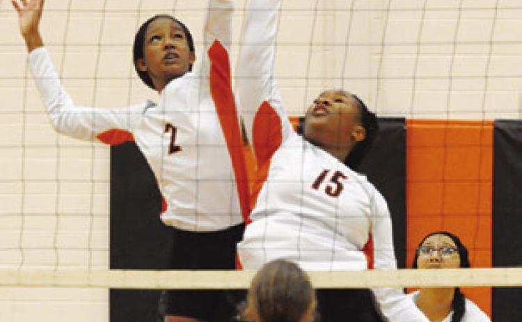 BOTH KARYS ELLIS and Keira Moore jump for the ball during the Somerville-ILTexas match last Friday night in Somerville. Tribune photo by Denise Squier