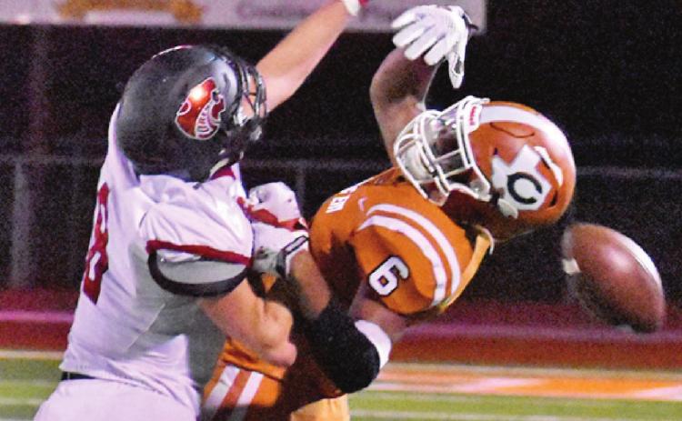 CALDWELL’S TRE BURNS and this Lorena defender fight for the ball in last Friday night’s game. -- Tribune photo by Roy Sanders