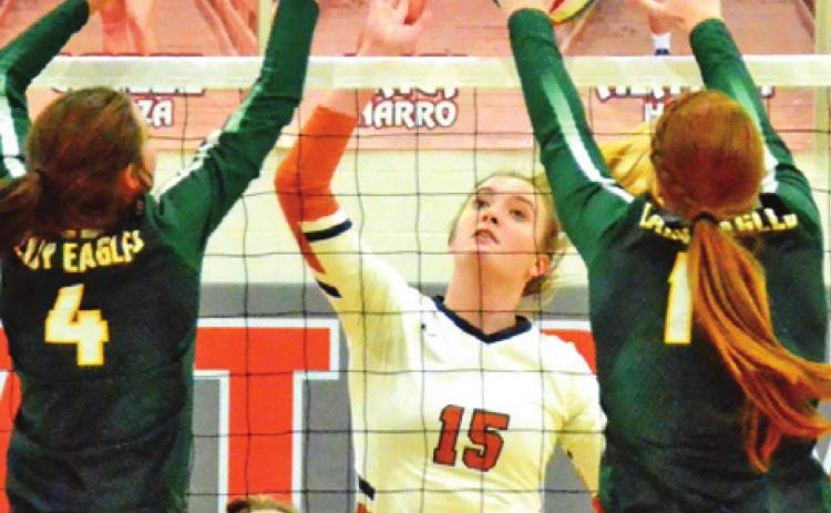 THE NUMBER 2 LEXINGTON Lady Eagles dominated the net play last Tuesday night, defeating the Lady Hornets at home. Pictured are Lexington’s Riley Stamport and Kenzie Muhl attempting to block a hit by Caldwell’s Elizabeth See. -- Tribune photo by Miranda Jones