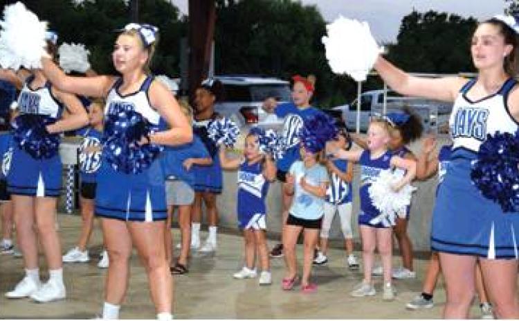 THE SNOOK MINI-CHEERLEADERS JOINED the Snook High School varsity cheerleaders in a dance and a couple of cheers to get the Snook faithful excited for the school year during Monday night’s Meet the Bluejays at Snook City Park. -- Tribune photo by Denise Hornaday