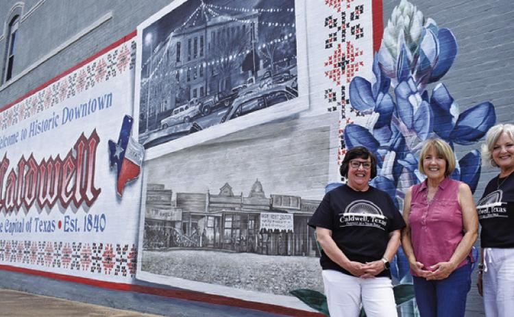 LIA ZACCAGNINO, BETSY WELHAUSEN and Janice Easter stand in front of this mural. Tribune photo by Roy Sanders