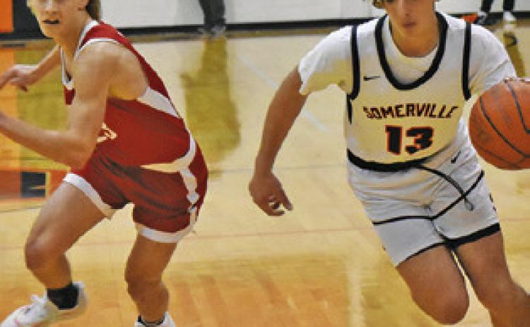 TANNER MOORE OF Somerville dribbles the ball against Burton. Tribune photo by Roy Sanders