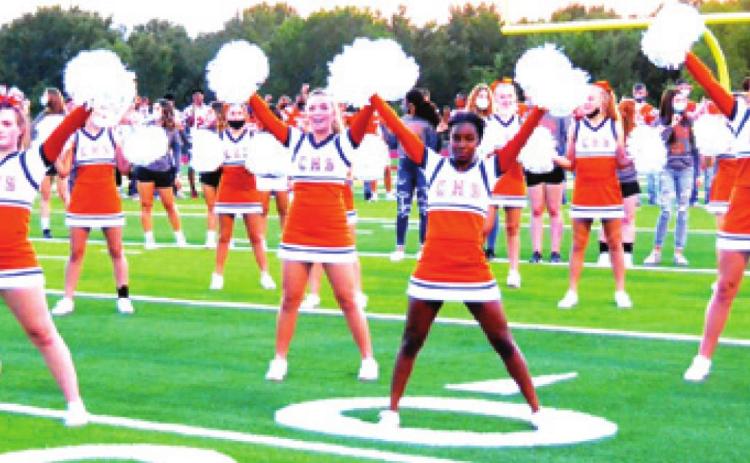 CALDWELL HIGH SCHOOL’S CHEERLEADERS perform for the crowd during Meet the Hornets on Monday night at Hornet Field. -- Tribune photo by Roy Sanders