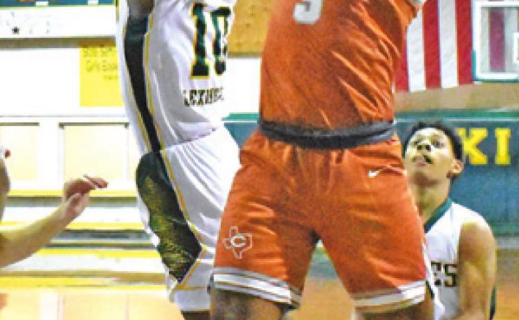 TRE BURNS of Caldwell reaches for the ball in the Friday game at Lexington.