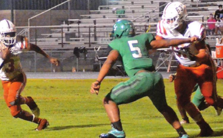 DONTAVIEN JOHNSON BREAKS free as Ryan Broaddus blocks in the Hornets’ victory.